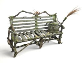 wood bench sculpture with wood branches